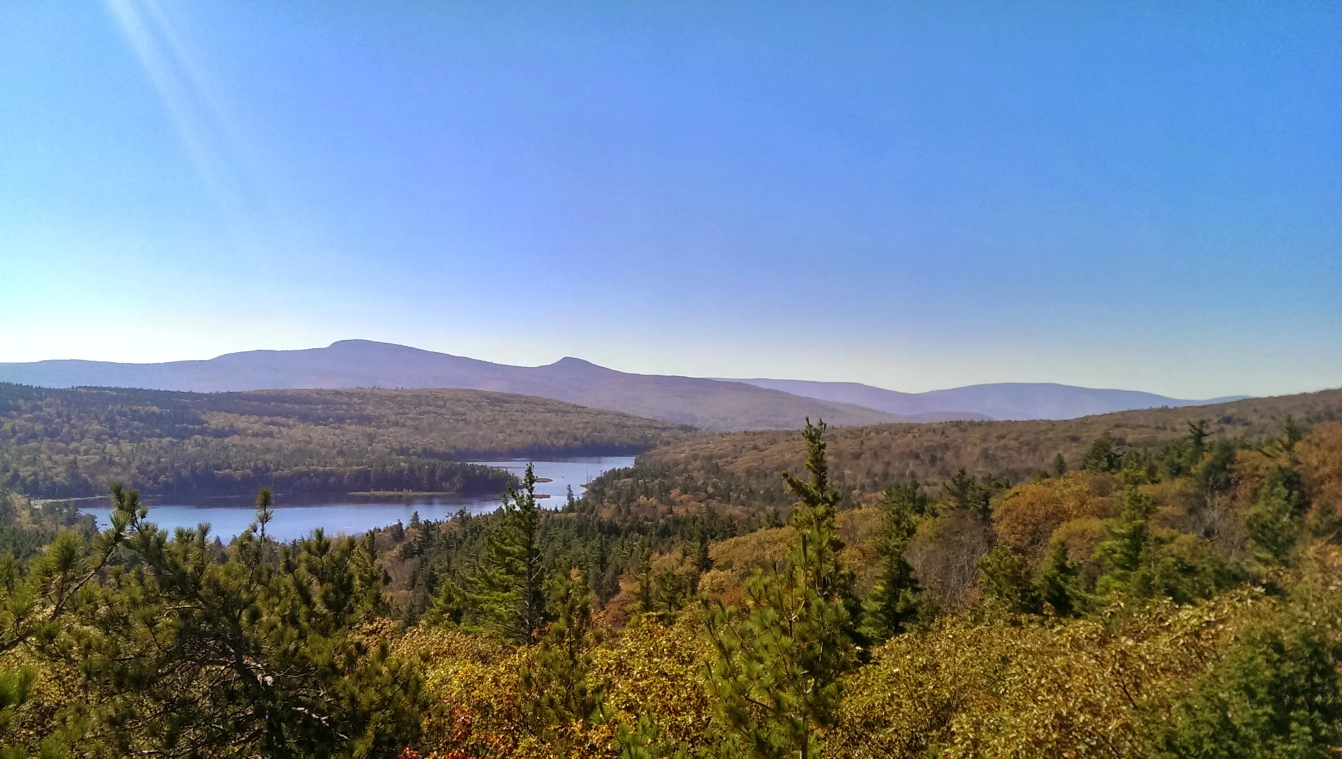 A scenic view of the Hudson Valley with mountains and a river.